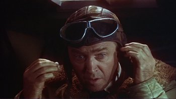 Movie still from “The Spirit of St. Louis” (1957), directed by Billy Wilder – An older man wearing a leather jacket and goggles; Close Up shot, Low angle