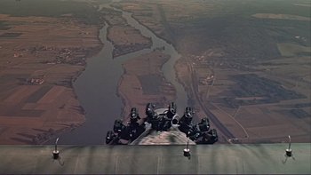 Movie still from “The Spirit of St. Louis” (1957), directed by Billy Wilder – A group of people standing on top of a building; Extreme Wide shot, Overhead angle