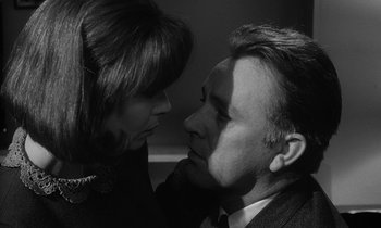 Movie still from “The Spy Who Came in from the Cold” (1965), directed by Martin Ritt – A man and a woman face to face in a black and white photo; Close Up shot, Low angle