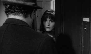 Movie still from “The Spy Who Came in from the Cold” (1965), directed by Martin Ritt – A man and a woman looking in the same mirror; Close Up shot, Over the shoulder angle