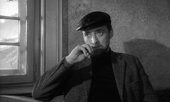 Movie still from “The Spy Who Came in from the Cold” (1965), directed by Martin Ritt – A black and white photo of a man wearing a hat; Close Up shot, Low angle