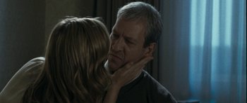 Movie still from “The Square” (2008), directed by Nash Edgerton – A man and a woman touching their faces together; Close Up shot, Over the shoulder angle