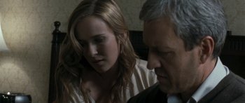 Movie still from “The Square” (2008), directed by Nash Edgerton – A woman and a man are talking to each other; Close Up shot, Over the shoulder angle