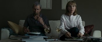 Movie still from “The Square” (2008), directed by Nash Edgerton – A man and a woman sitting at a table with wine glasses; Medium shot, High angle
