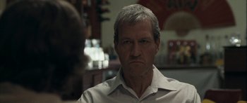 Movie still from “The Square” (2008), directed by Nash Edgerton – An older man in a white dress shirt; Close Up shot, Over the shoulder angle