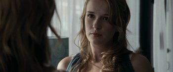 Movie still from “The Square” (2008), directed by Nash Edgerton – A beautiful young woman looking at the camera; Close Up shot, Over the shoulder angle