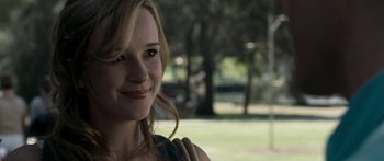 Movie still from “The Square” (2008), directed by Nash Edgerton – A person smiling for the camera; Close Up shot, Over the shoulder angle