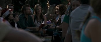 Movie still from “The Square” (2008), directed by Nash Edgerton – A group of people sitting around a table; Medium shot, Over the shoulder angle