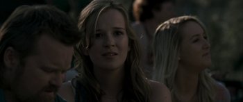 Movie still from “The Square” (2008), directed by Nash Edgerton – A woman with long blonde hair is looking at the camera; Close Up shot, Over the shoulder angle