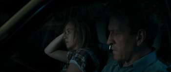 Movie still from “The Square” (2008), directed by Nash Edgerton – A woman and a man sitting in the back of a car; Close Up shot, Over the shoulder angle