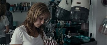 Movie still from “The Square” (2008), directed by Nash Edgerton – A woman standing in front of a table with a cake on it; Close Up shot, Over the shoulder angle