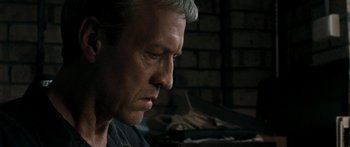 Movie still from “The Square” (2008), directed by Nash Edgerton – An older man is looking down at his face; Close Up shot, Low angle