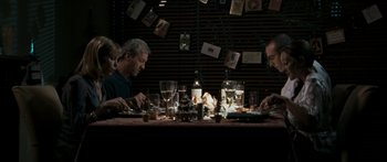 Movie still from “The Square” (2008), directed by Nash Edgerton – A group of people sitting at a dinner table; Medium shot, Over the shoulder angle