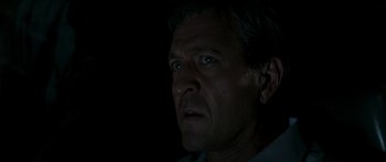 Movie still from “The Square” (2008), directed by Nash Edgerton – A person looking at the camera; Close Up shot, Low angle