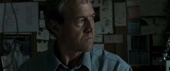 Movie still from “The Square” (2008), directed by Nash Edgerton – A person wearing a blue shirt; Close Up shot, Low angle