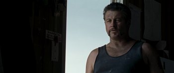 Movie still from “The Square” (2008), directed by Nash Edgerton – A person wearing a tank top; Close Up shot, Low angle