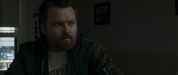 Movie still from “The Square” (2008), directed by Nash Edgerton – A person with a beard; Close Up shot, Over the shoulder angle