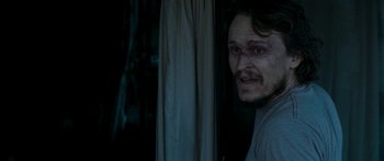 Movie still from “The Square” (2008), directed by Nash Edgerton – A person looking at the camera; Close Up shot, Over the shoulder angle