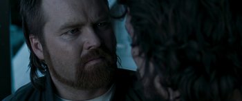Movie still from “The Square” (2008), directed by Nash Edgerton – A person with a beard; Close Up shot, Over the shoulder angle