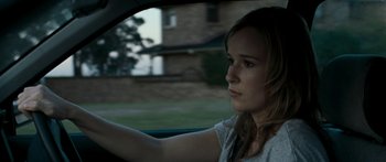 Movie still from “The Square” (2008), directed by Nash Edgerton – A woman sitting in the drivers seat of a car; Close Up shot, Over the shoulder angle