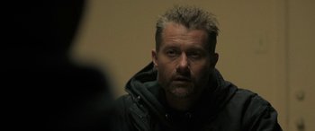 A person wearing a hooded jacket