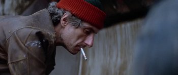 Movie still from “The Star Chamber” (1983), directed by Peter Hyams – A person with a cigarette in his mouth; Close Up shot, Low angle