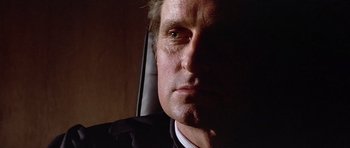 Movie still from “The Star Chamber” (1983), directed by Peter Hyams – A man's face in a car seat; Close Up shot, Low angle