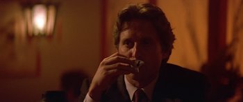 Movie still from “The Star Chamber” (1983), directed by Peter Hyams – A person wearing a suit and tie; Close Up shot, Low angle