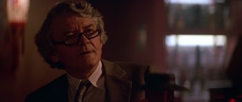 Movie still from “The Star Chamber” (1983), directed by Peter Hyams – An older man wearing a suit and tie; Close Up shot, Low angle