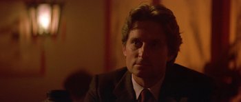 Movie still from “The Star Chamber” (1983), directed by Peter Hyams – A person wearing a suit and tie; Close Up shot, Over the shoulder angle