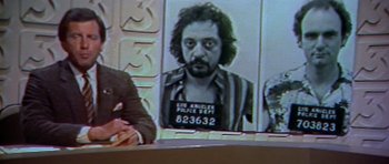 Movie still from “The Star Chamber” (1983), directed by Peter Hyams – A picture of a man in a jail uniform; Medium shot, Low angle