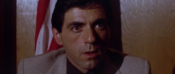 Movie still from “The Star Chamber” (1983), directed by Peter Hyams – A man's face in a suit; Close Up shot, Low angle