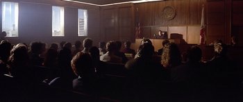 Movie still from “The Star Chamber” (1983), directed by Peter Hyams – A group of people sitting in a courtroom; Wide shot, High angle