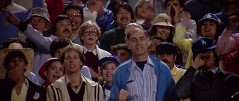Movie still from “The Star Chamber” (1983), directed by Peter Hyams – A large group of people are gathered together in a crowd; Medium shot, Low angle
