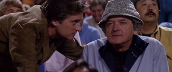 Movie still from “The Star Chamber” (1983), directed by Peter Hyams – A man and a woman are talking to each other; Close Up shot, Over the shoulder angle