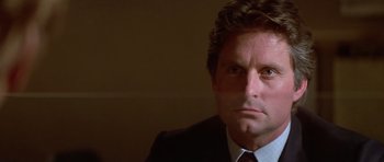 Movie still from “The Star Chamber” (1983), directed by Peter Hyams – A person wearing a suit and tie; Close Up shot, Over the shoulder angle