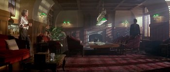 Movie still from “The Star Chamber” (1983), directed by Peter Hyams – A living room filled with furniture and a fire place; Extreme Wide shot, High angle