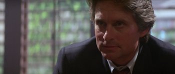 Movie still from “The Star Chamber” (1983), directed by Peter Hyams – A person wearing a suit and tie; Close Up shot, Low angle