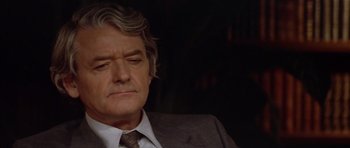 Movie still from “The Star Chamber” (1983), directed by Peter Hyams – An older man wearing a suit and tie; Close Up shot, Low angle