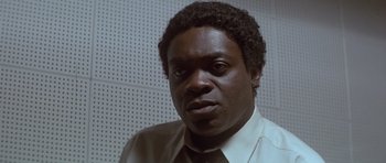 Movie still from “The Star Chamber” (1983), directed by Peter Hyams – A person wearing a shirt and tie; Close Up shot, Low angle