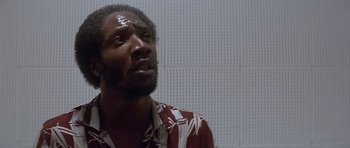 Movie still from “The Star Chamber” (1983), directed by Peter Hyams – A person wearing a hawaiian shirt; Close Up shot, Low angle