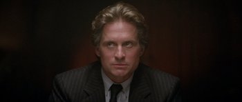 Movie still from “The Star Chamber” (1983), directed by Peter Hyams – A person wearing a suit and tie; Close Up shot, Low angle