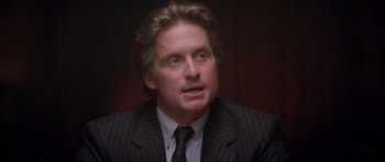 Movie still from “The Star Chamber” (1983), directed by Peter Hyams – A person wearing a suit and tie; Close Up shot, High angle