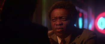 Movie still from “The Star Chamber” (1983), directed by Peter Hyams – A person wearing a suit and tie; Close Up shot, Over the shoulder angle