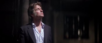 Movie still from “The Star Chamber” (1983), directed by Peter Hyams – A person wearing a suit looking up; Close Up shot, Low angle