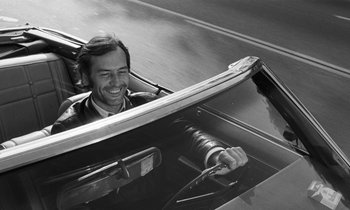 Movie still from “The State of Things” (1982), directed by Wim Wenders – A black and white photo of a man in a car; Close Up shot, Low angle
