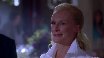 Movie still from “The Stepford Wives” (2004), directed by Frank Oz – A person wearing a white shirt; Close Up shot, Over the shoulder angle