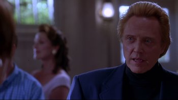 Movie still from “The Stepford Wives” (2004), directed by Frank Oz – A person wearing a suit and tie; Close Up shot, Low angle