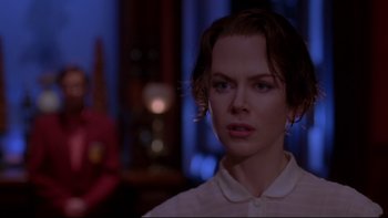 Movie still from “The Stepford Wives” (2004), directed by Frank Oz – A young woman is looking into the distance; Close Up shot, Over the shoulder angle