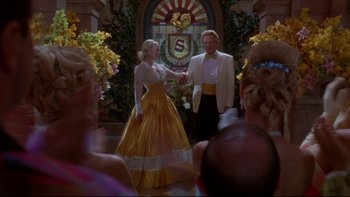 Movie still from “The Stepford Wives” (2004), directed by Frank Oz – A man and a woman dressed in formal wear; Wide shot, Over the shoulder angle